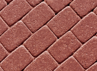 Red color cobblestone pavement surface.
