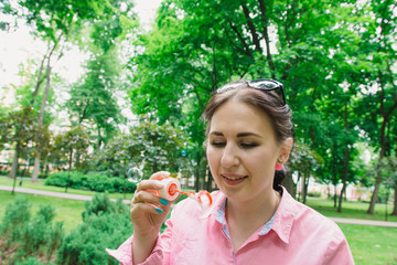 Fototapeta premium Children walk in the park on a day off. The sun is shining