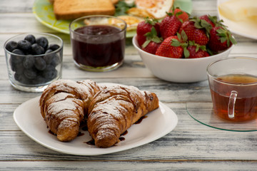 Croissant with chocolate syrup