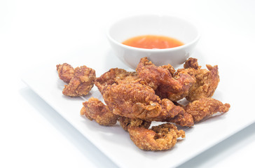 Fried chicken skin on white background.
