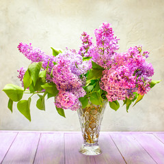 still life bouquet of lilac flowers on the table