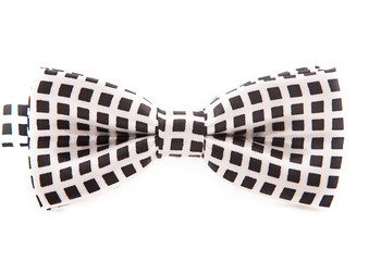 White bow in a black cage on a white background