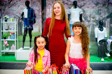 Mother and daughters shopping