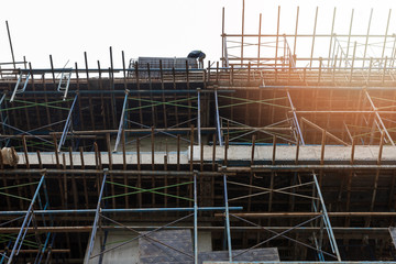 Building under construction. The site against blue sky