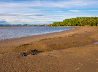 Channels in the sands at Arnside with Cumbrian hills in the background, Arnside, Lancashire, UK