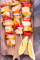 Grilled salmon and vegetables on skewers.