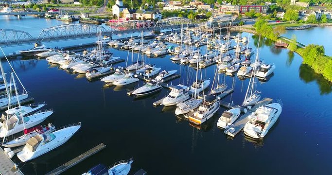 Sturgeon Bay Wisconsin's beautiful canal waterfront marina with sailboats, bridge and tugboats, aerial view.