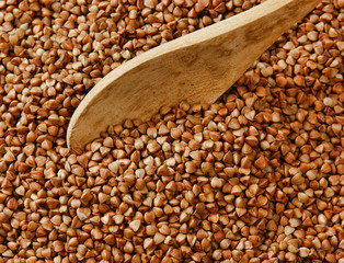 buckwheat groats and wooden spoon