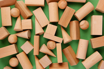 wooden geometric shapes on a green background