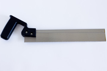 Iron saw on white background. Saw with a black plastic handle on a white background
