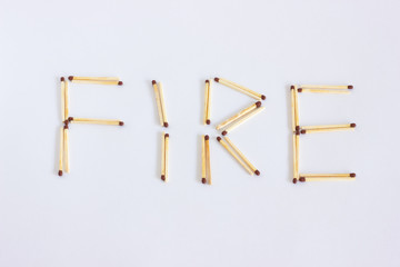 The inscription from the matches is fire. The word is laid out of wooden matches.
