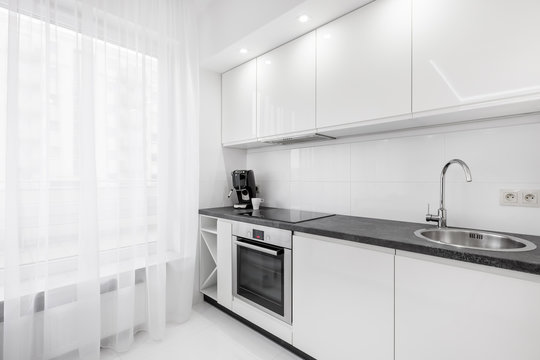 White kitchen with black countertop