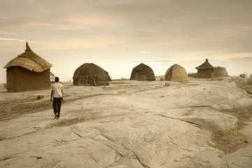 Mali, West Africa - Peul village and typical mud buildings - obrazy, fototapety, plakaty