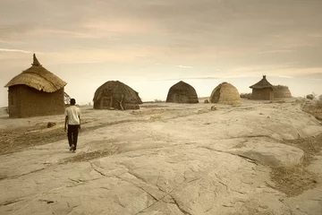 Gordijnen Mali, West Africa - Peul village and typical mud buildings © robertonencini