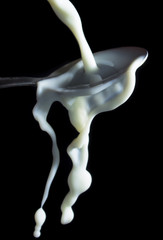 Milk poured over spoon
