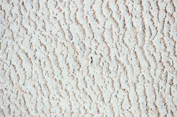 White relief texture of the foam block. Aerated concrete. Pattern.