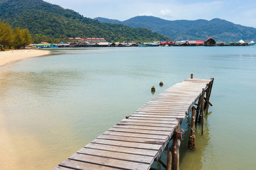 Wooden jetty on exotic beach Koh Chang island, Thailand