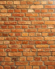 Old red brick wall closeup for vertical background