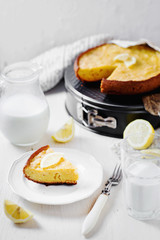 Desserts and pastries, sweet food, lemon biscuit pie with milk on a light wooden background 