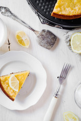 Desserts and pastries, sweet food, lemon biscuit pie with milk on a light wooden background 