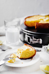 Desserts and pastries, sweet food, lemon biscuit pie with milk on a light wooden background 