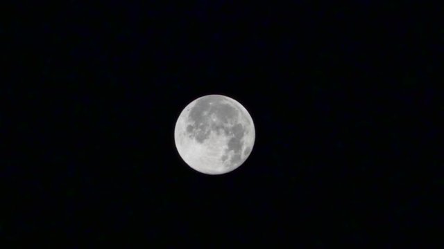 Blue Full Moon with passing clouds, Real Time. Blue Moon in night sky on August 1, 2015 in Istanbul. Blue Moon is the third full moon in a season with four full moons. When one of the astronomical sea