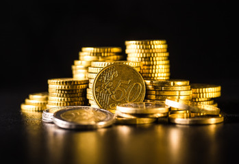 Euro coins.Coins stacked on each other in different positions. Money concept