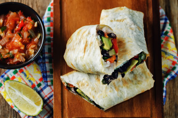 Rice black bean avocado tomato burritos