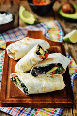 Rice black bean avocado tomato burritos