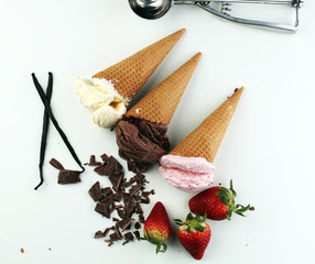 three scoops of ice cream - vanilla, strawberry and chocolate