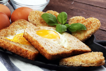 fried eggs and toast with basil pepper and salt