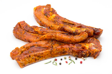 Spicy marinated spare ribs barbecued on the white background.