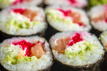 The plate of sushi with soy sauce, wasabi