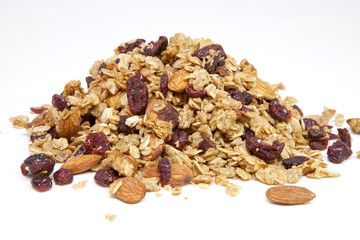 Mound of granola with almonds and dried cranberries.