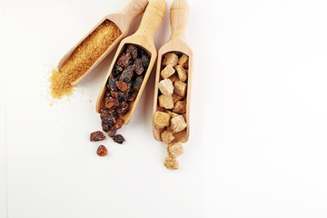 Composition with brown sugar on white background