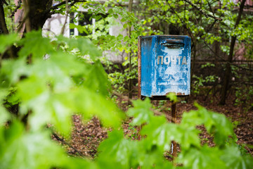 decayed blue ukrainian mailbox in Prypjat