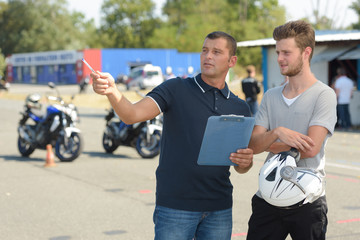 Man receiving instructions at motorcycle training course