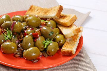 marinated green olives with toast
