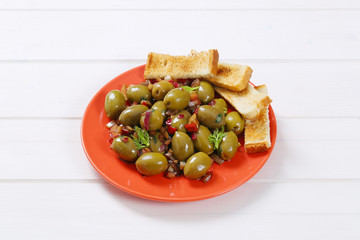 marinated green olives with toast