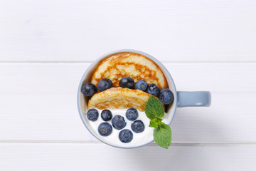 american pancakes with yogurt and blueberries