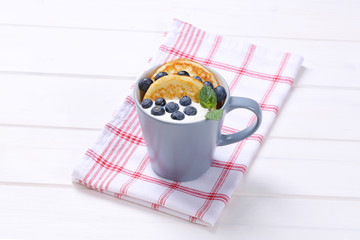 american pancakes with yogurt and blueberries