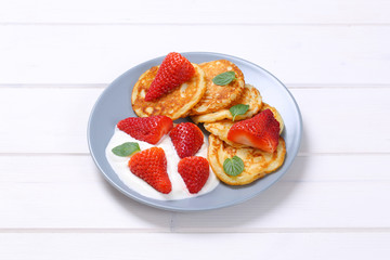 american pancakes with yogurt and strawberries