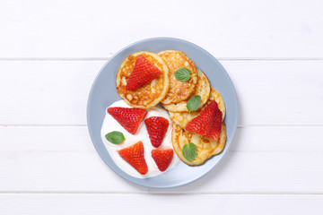 american pancakes with yogurt and strawberries