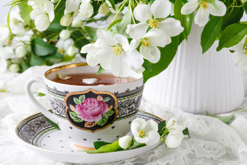 Still life with tea cup on wooden background