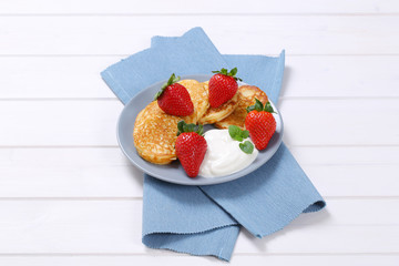 american pancakes with yogurt and strawberries