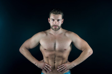 Fototapeta na wymiar strong handsome sexy man with muscular body and serious unshaven face