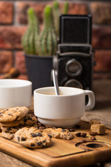 hot black coffee with cookies and beans in cafe
