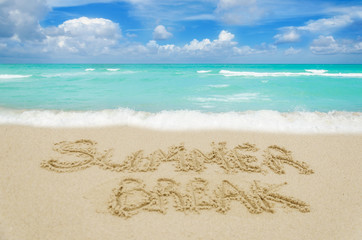Fototapeta na wymiar Sign Summer Break on the sandy beach