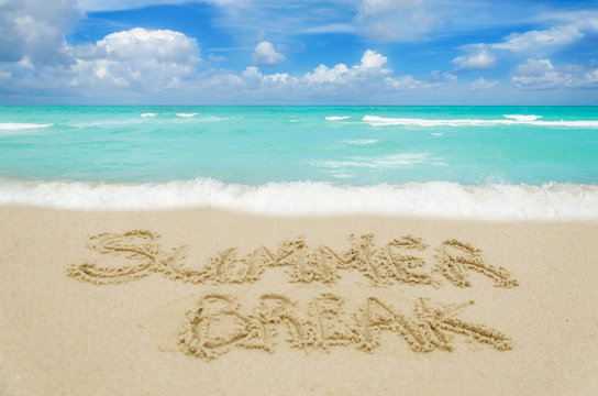 Sign Summer Break on the sandy beach
