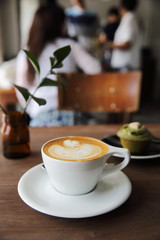 cappuccino coffee on wood background